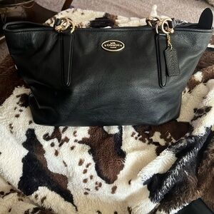 Coach black leather satchel. Lightly used. Excellent condition.